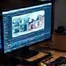 Editing suite with image on screen.